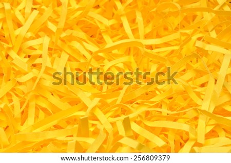 Yellow shredded paper as backgroud, packaging material