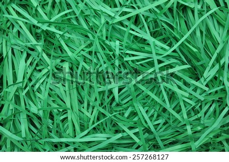 Green shredded paper as background, packaging material