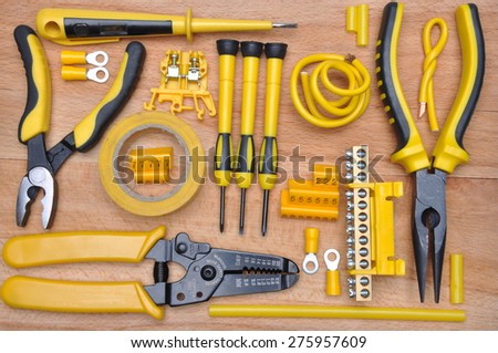 Tools for electrical installation on wooden board