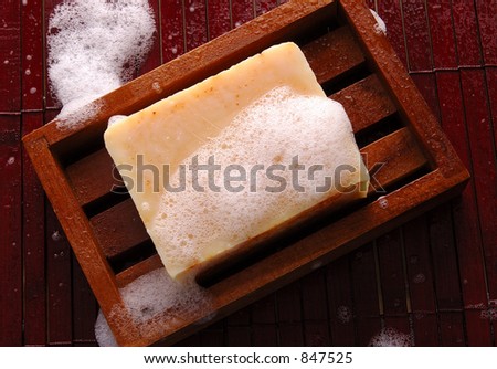 Sudsy soap in a wooden dish