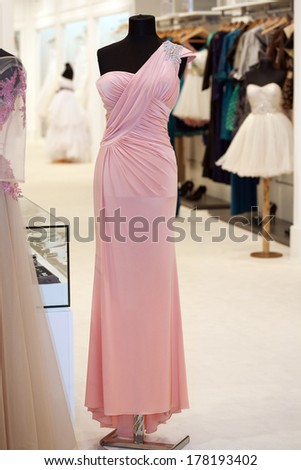 Beautiful pink gown on mannequin in a bridal shop