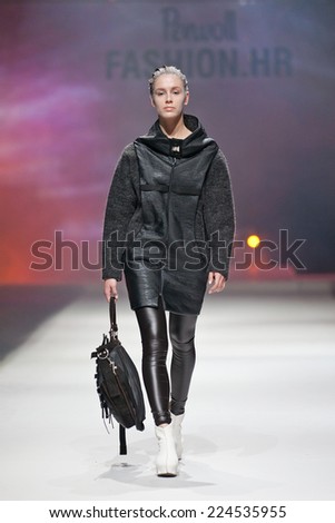 ZAGREB, CROATIA - OCTOBER 18, 2014: Fashion model wearing clothes designed by Marina Design and Marija Ivanovic bag on the \'Fashion.hr\' fashion show