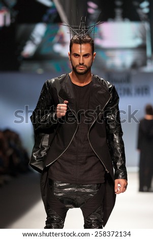 ZAGREB, CROATIA - OCTOBER 18, 2014: Fashion model wearing clothes designed by Coded Edge on the \'Fashion.hr\' fashion show