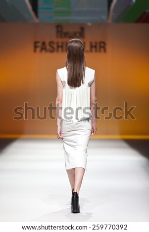 ZAGREB, CROATIA - OCTOBER 18, 2014: Fashion model wearing designer clothes on the \'Fashion.hr\' fashion show