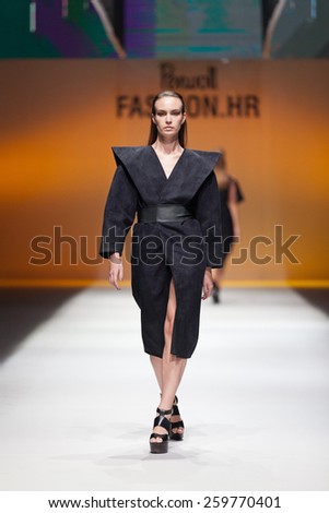 ZAGREB, CROATIA - OCTOBER 18, 2014: Fashion model wearing designer clothes on the \'Fashion.hr\' fashion show