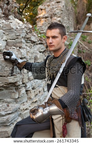 ZAGREB, CROATIA - OCTOBER 07, 2012: Man dressed in medieval clothes with sword, posing after the \