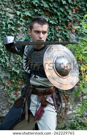 ZAGREB, CROATIA - OCTOBER 07, 2012: Man dressed in medieval clothes with sword, posing after the \