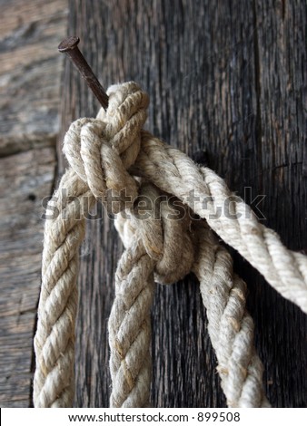 Rusty nail and a knot