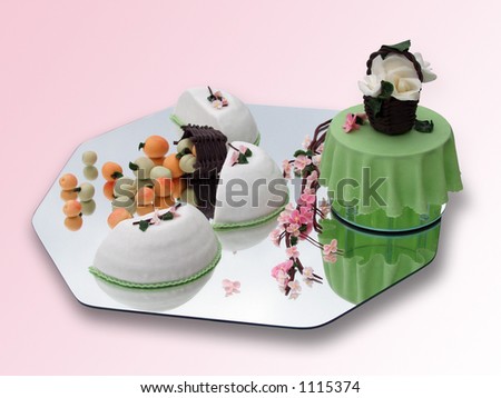 Springtime marzipan food arrangement on pink