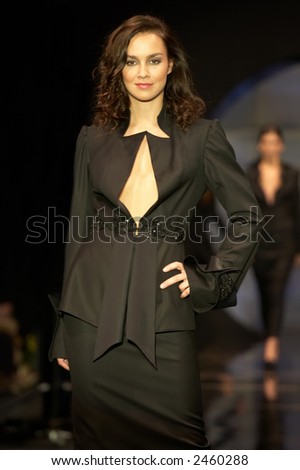 Fashion model posing in a black suite
