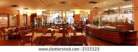 Restaurant interior with served tables panorama