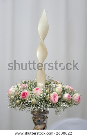 Elegant candlestick decorated with pink mini roses