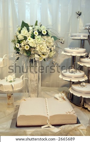 stock photo Detail of a wedding cakes and white wedding bouquet