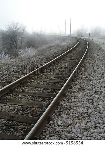 Railroad train tracks in the cold winter morning