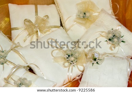 stock photo Wedding ring cushions with flowers and ribbons