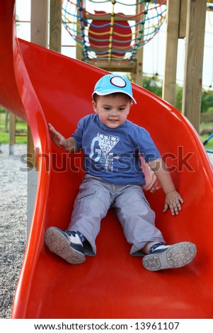 Little boy on the slide