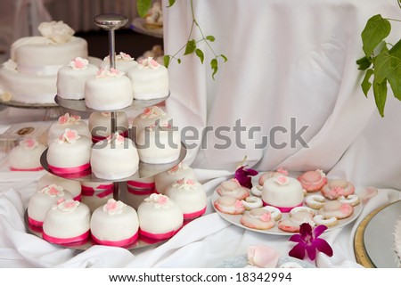 Table decorated with wedding cakes