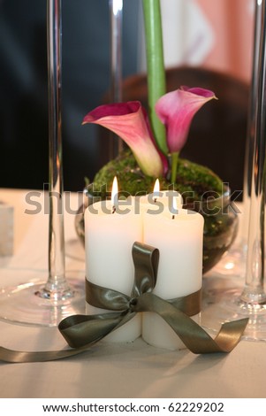Three candles and calla lily decoration