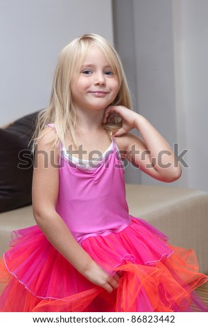 Little girl playing dress up