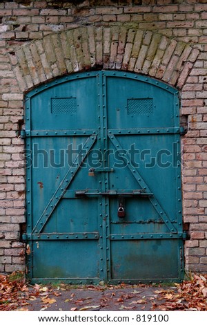 Old strong door to the warehouse, metal,