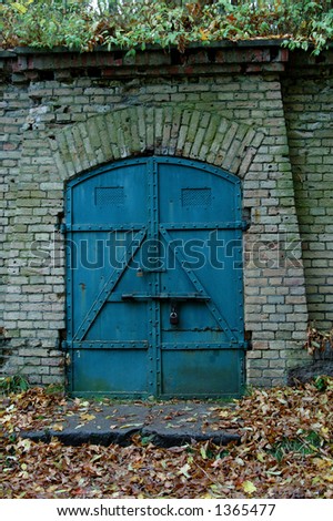 Old strong door to the warehouse, metal.