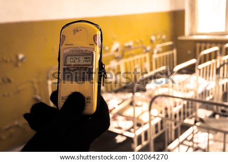 Geiger counter in nursery at Chernobyl with blurry background