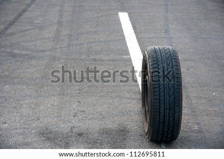 Car tire on the road outdoors