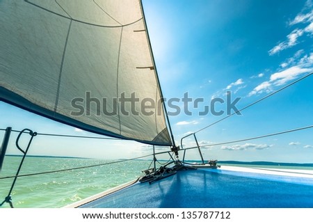 Sailing Boat On The Water In Sunshine