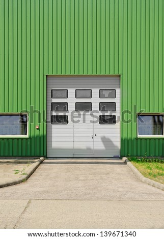 Large industrial door on a warehouse wall