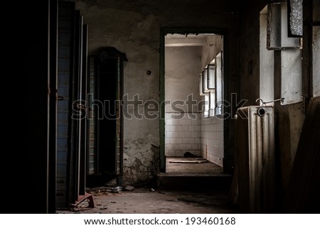 Dark room with steel lockers inside closeup