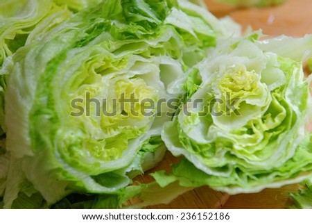 Fresh Green Iceberg lettuce prepared on table