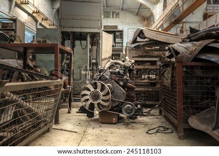 The image of an used engine in empty factory