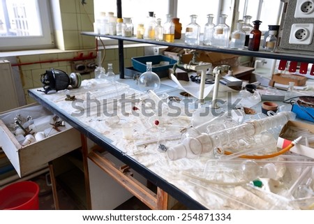 Old laboratory with a lot of bottles recorded with glider