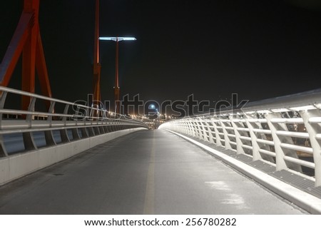 Empty bridge at night with lights photo