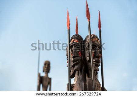 African Warriors under blue sky with spear