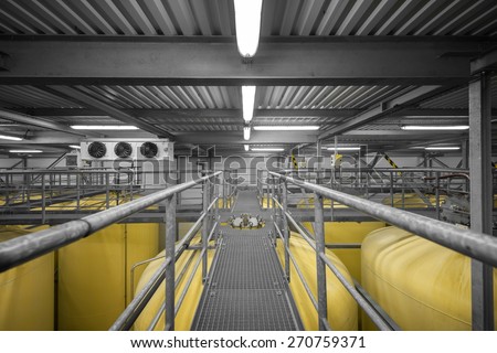 Industrial interior with welded silos from above