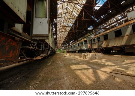Cargo trains in old train depot eaten by rust