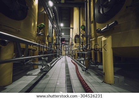 Industrial interior with welded silos angle shot