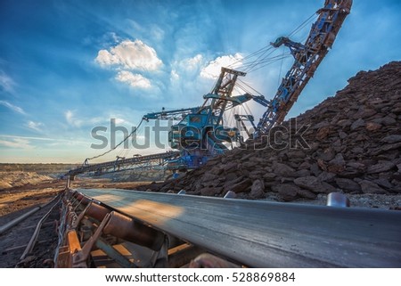 Long conveyor belt transporting ore