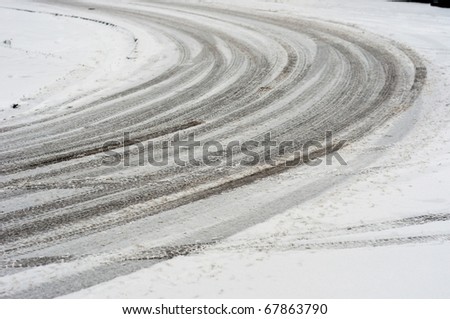 curve in the road with snow