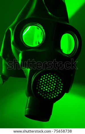 A military gasmask in green light
