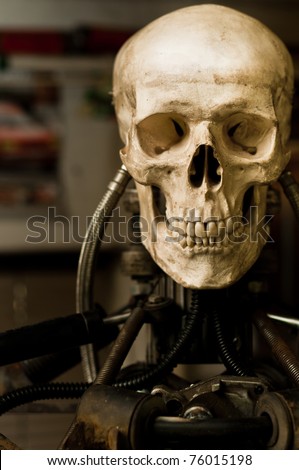 Human skull on robot body close up