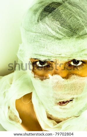 Scary portrait of a girl wrapped in bandage