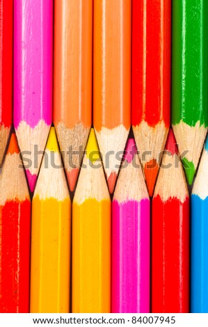 Texture of colorful pencils lined up in a row