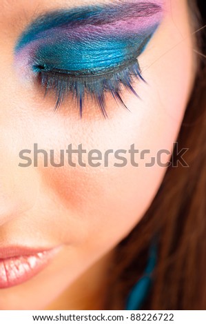 closeup photo of a girl with beautiful makeup and selected focus