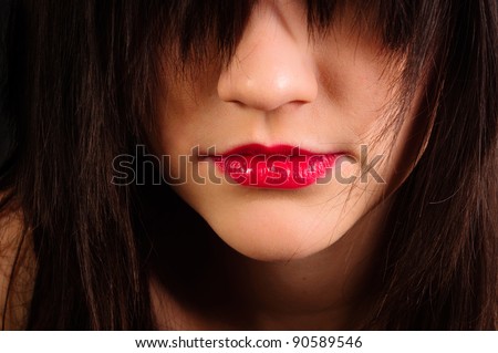Lips of an attractive girl with her hair hiding her eyes