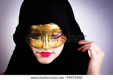 Closeup photo of a woman in black hood and red lips