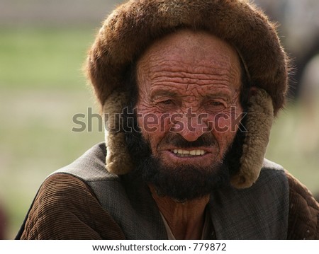 An elderly Afghan man at a Buzkashi match played in Kabul, Afghanistan
