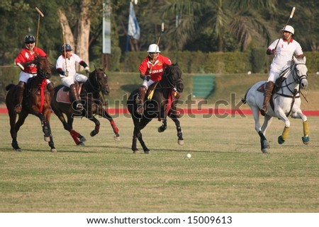 DELHI - JANUARY 2008: Polo players from the India Army (in red) square off against those from 