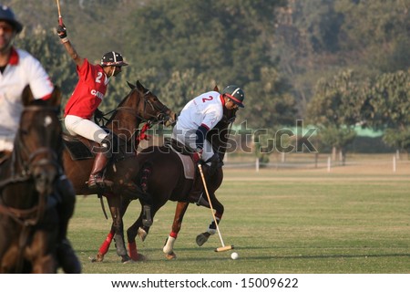 DELHI - JANUARY 2008: Polo players from the India Army (in red) square off against those from \